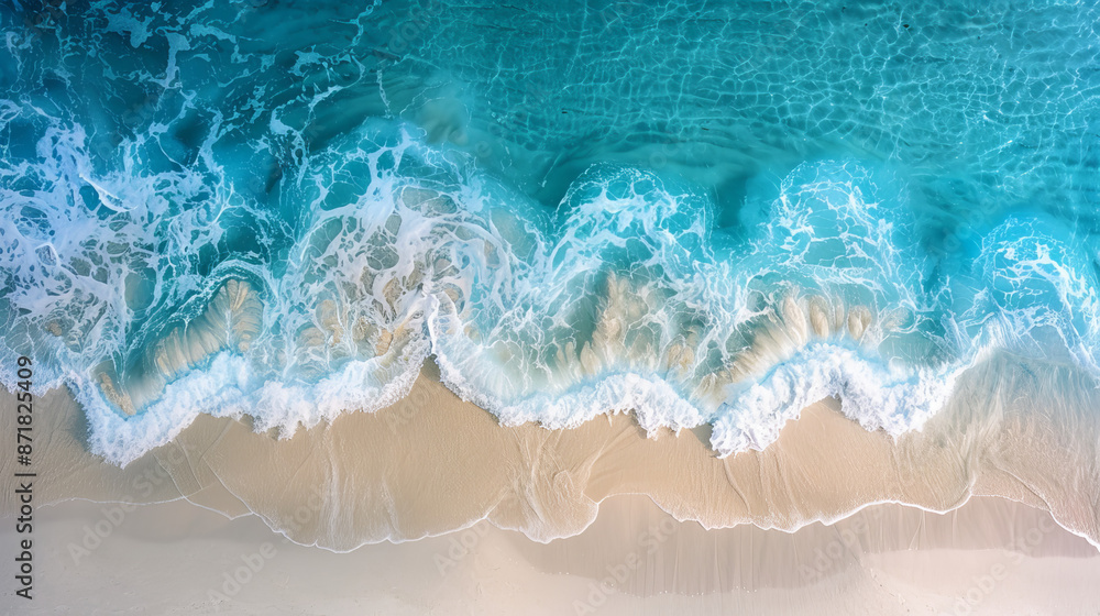 Panoramic view of a sandy beach from above. The waves gently roll onto the shore. Panoramic view of a sandy beach from above. The waves gently roll onto the shore.