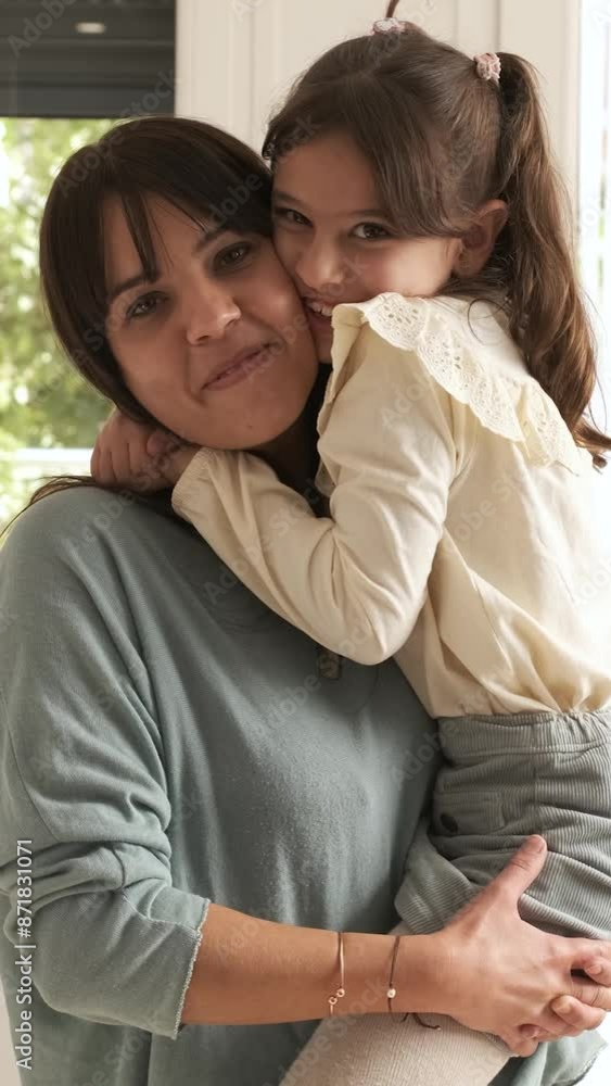 Mother and girl embracing and smiling Mother and girl embracing and smiling