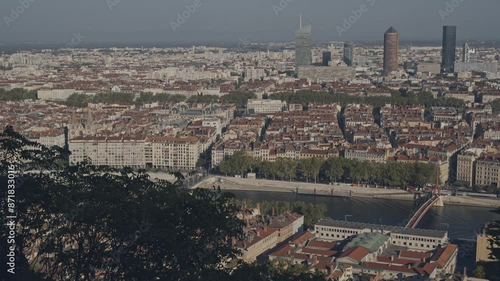 A vast city landscape featuring tall buildings and lush greenery in a panoramic view