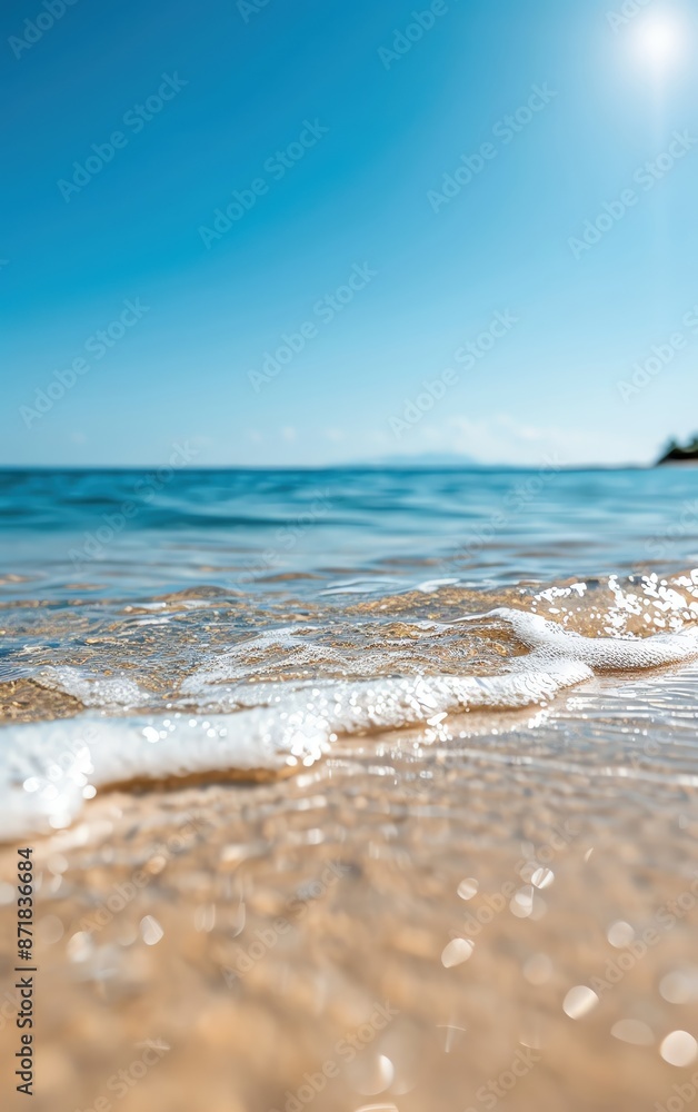 A serene coastline with gentle waves crashing on a sandy beach under a clear blue sky. Perfect summer vacation destination. A serene coastline with gentle waves crashing on a sandy beach under a clear blue sky. Perfect summer vacation destination.