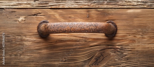 Close-up image of furniture handle on a wooden texture background with space for copying. photo