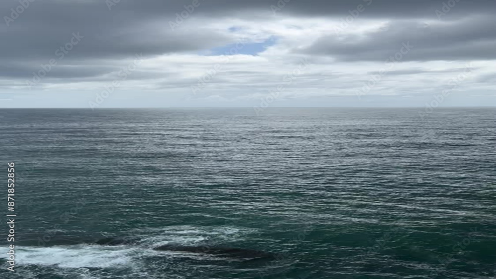 Sea waves after storm and dramatic sky clouds, vertical video Sea waves after storm and dramatic sky clouds, vertical video