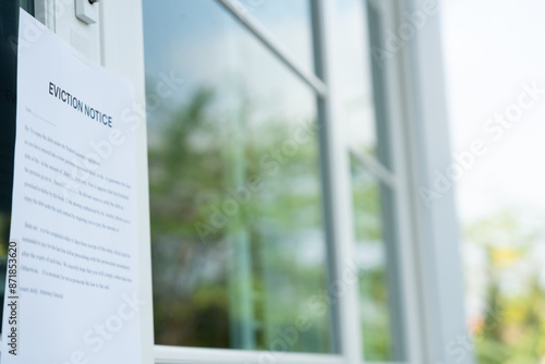 Photos document with the text eviction notice, Civil servant sticks a notice of evictio