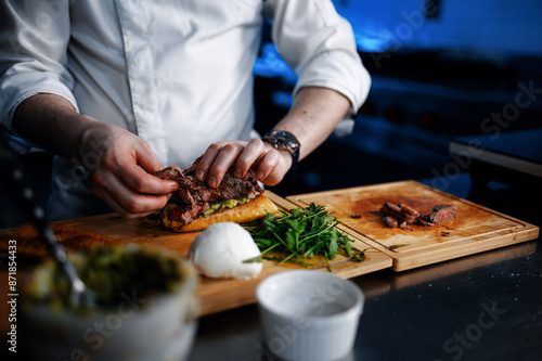 Chef preparing a beef sandwich