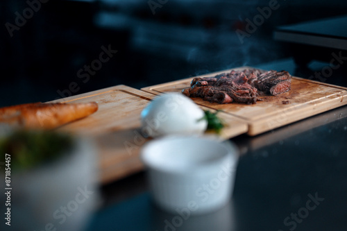 Meat on steak with smoke