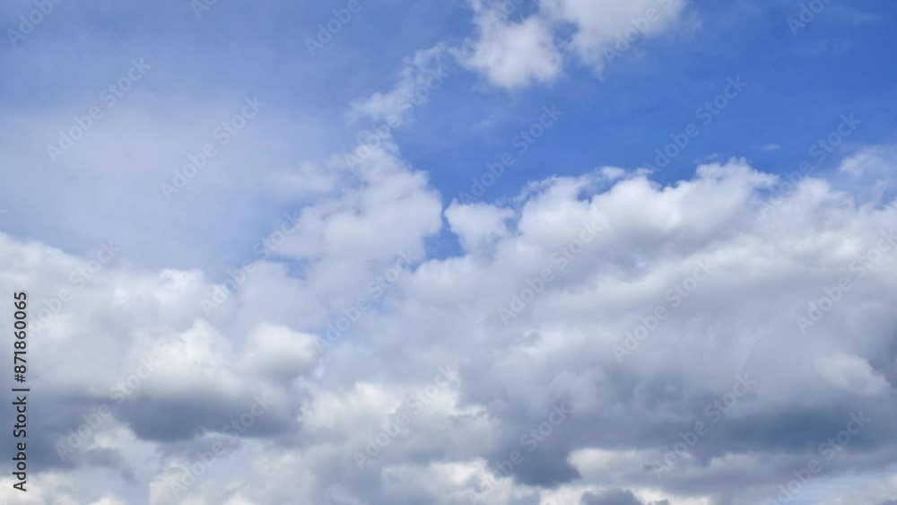 Timelapse of puffy clouds moving across the blue sky Timelapse of puffy clouds moving across the blue sky