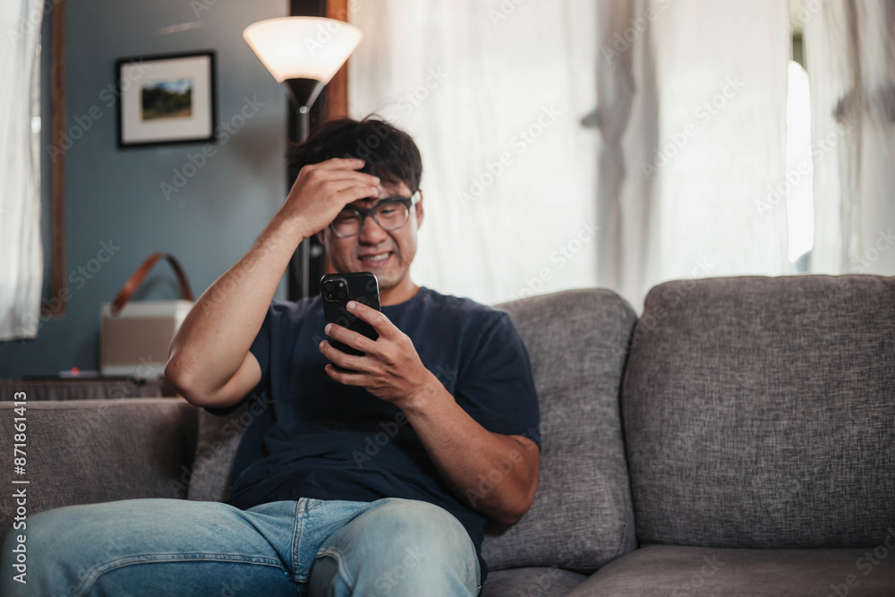 Fototapeta premium sad depression serious people from work,study stress problem.asian man feeling tired suffering using cell phone working work place.concept global economic,health problems