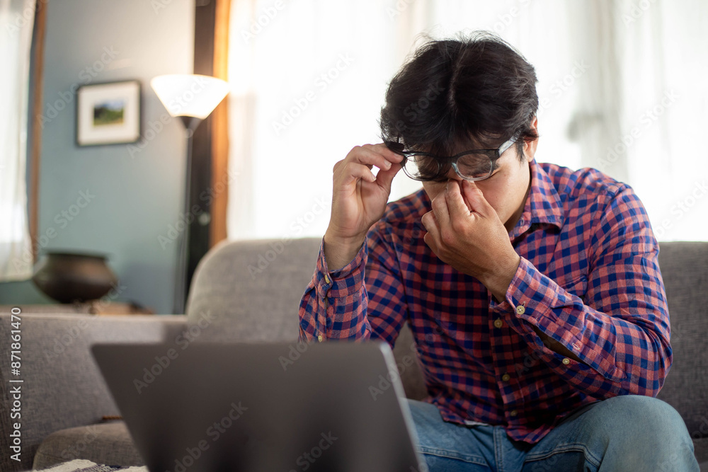 sad depression serious people from work,study stress problem.asian man feeling tired suffering using computer working work place.concept global economic,health problems sad depression serious people from work,study stress problem.asian man feeling tired suffering using computer working work place.concept global economic,health problems