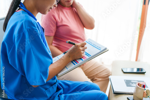 Asian female doctor and nurse consult on sofa with a pregnant woman, using ultrasound and stethoscope, addressing illnesses morning sickness, gestational diabetes, hypertension, ensuring her health. photo