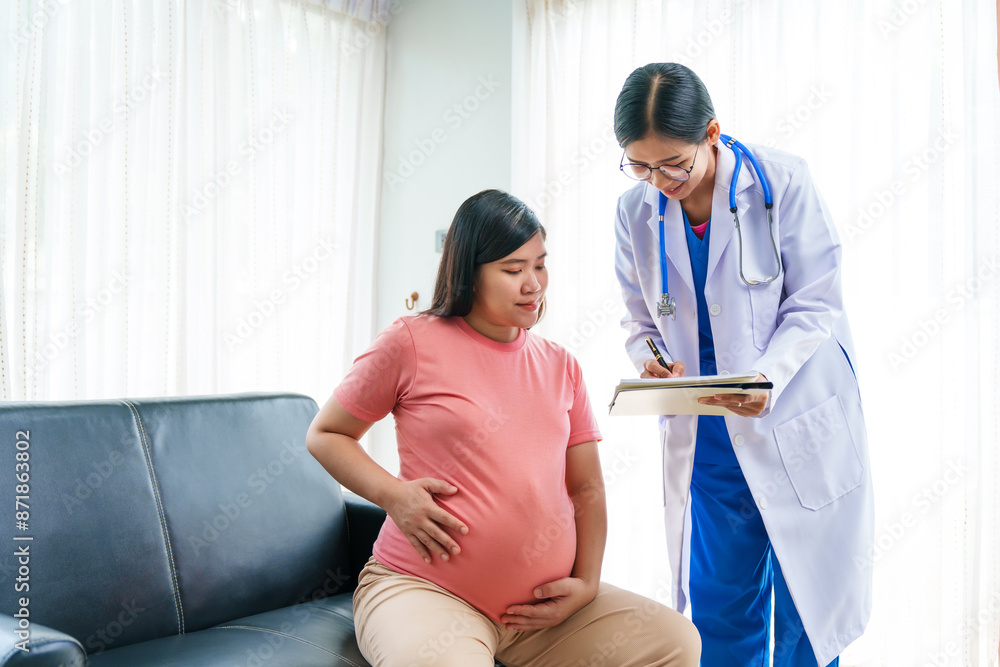 Asian female doctor nurse encouragement to a pregnant woman on a sofa, using ultrasound and stethoscope, addressing medical conditions like edema, varicose veins, and pregnancy-induced hypertension. Asian female doctor nurse encouragement to a pregnant woman on a sofa, using ultrasound and stethoscope, addressing medical conditions like edema, varicose veins, and pregnancy-induced hypertension.