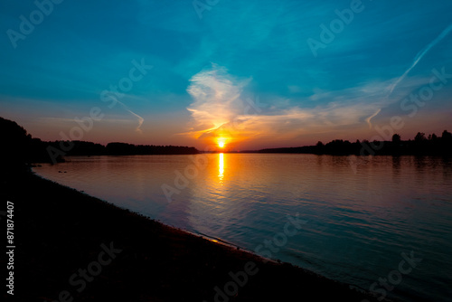 Obraz na płótnie Golden sunset on the beach at neva river in saint-petersburg, russia. Tranquil scene. Nature background. Landscape. High quality photo w salonie