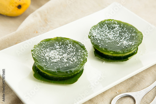 Chinese colorful green cake served in dish isolated on table side view hong kong baked food dessert photo