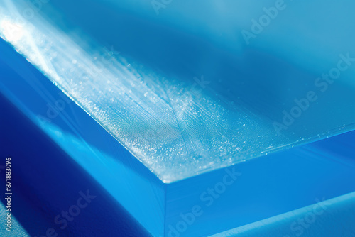 Macro Shot of Blue Plastic Material Texture with Hard Shadows and Reflections Under Studio Lighting photo