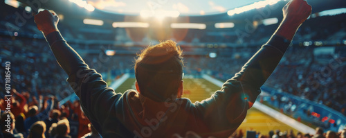 Male sports fan cheering at a football game photo