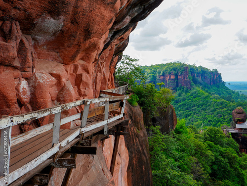 Phu Thok or Wat Chetiyakhiri ,Beautiful mountain landscape and wooden bridges on high rocky cliffs, Bueng Kan Province, Thailand. photo