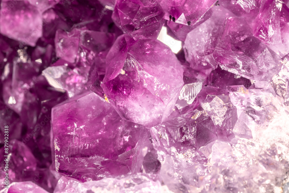 Amethyst pink crystals. Gems. Mineral crystals in the natural environment. Texture of precious and semiprecious stones. Seamless background with copy space colored shiny surface of precious stones. Amethyst pink crystals. Gems. Mineral crystals in the natural environment. Texture of precious and semiprecious stones. Seamless background with copy space colored shiny surface of precious stones.