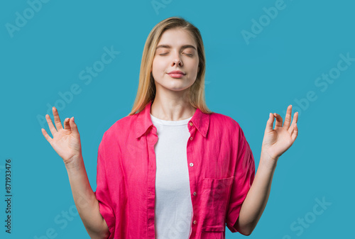 Calm young woman relaxing, meditating, refuses stress. Breathes, yoga, balance photo