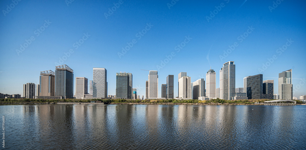 Naklejka premium Modern City Skyline by the Waterfront