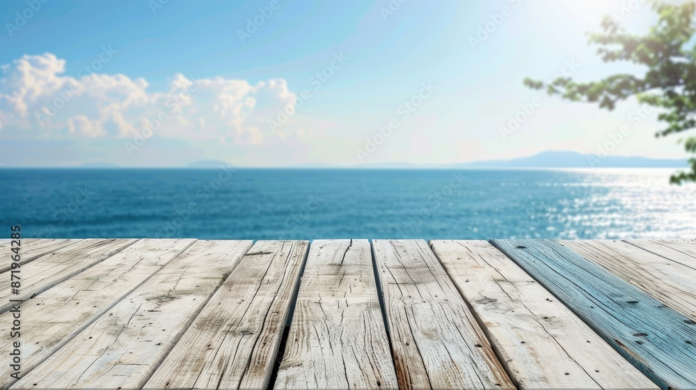 Fototapeta premium White horizontal wooden table top With a blurry background of the sea and sky. 