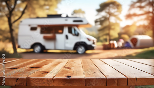 Wooden table in tent and motorhome on blurred mountain background. Cool and relaxing concept. For product display montage or key visual layout design. space for text