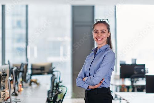 Confident Businesswoman: Blonde Executive Demonstrating Leadership with Crossed Arms.