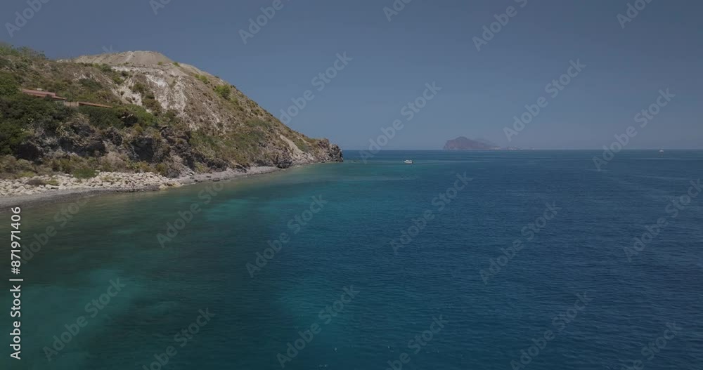 Aerial view of tranquil coastline with boats and rocky cliffs, Lipari, Aeolian Islands, Italy. Aerial view of tranquil coastline with boats and rocky cliffs, Lipari, Aeolian Islands, Italy.