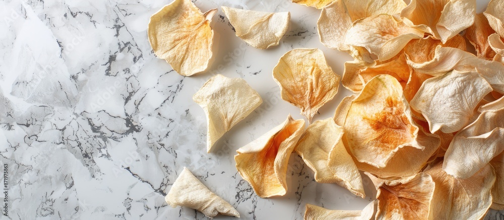 Southern Langsat's sweet airdried peel displayed on a marble background with copy space image. Southern Langsat's sweet airdried peel displayed on a marble background with copy space image.