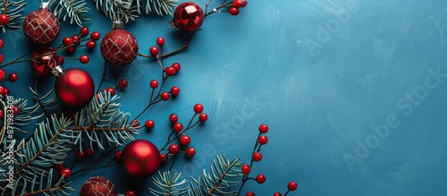 Festive Christmas decorations against a blue backdrop with copy space image.