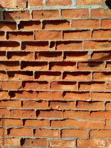 The Surface of the Cracked Wall in the House Building and Some Parts of the Bricks Are Visible