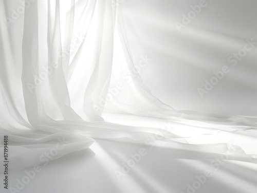 White silk fabric with flowing drapes, draped elegantly against a white background, creating an atmosphere of softness and tranquility photo