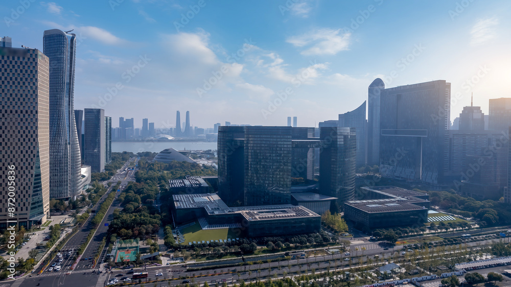 Obraz premium Modern Urban Cityscape with High-Rise Buildings by Waterfront