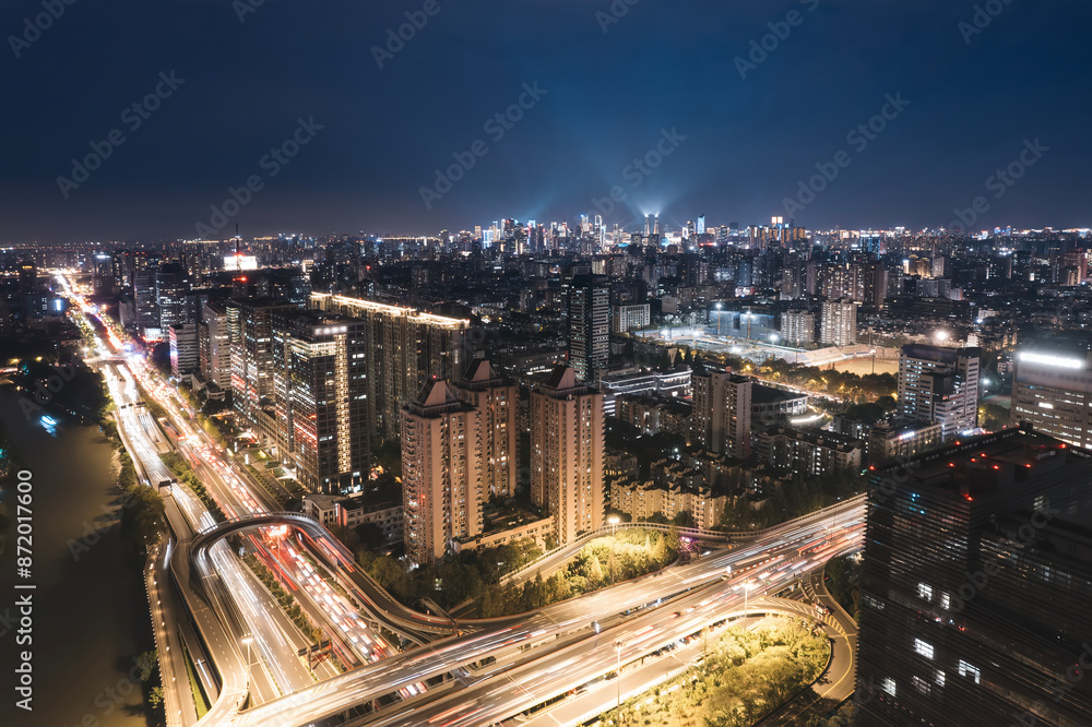Fototapeta premium Vibrant Nighttime Cityscape with Busy Streets
