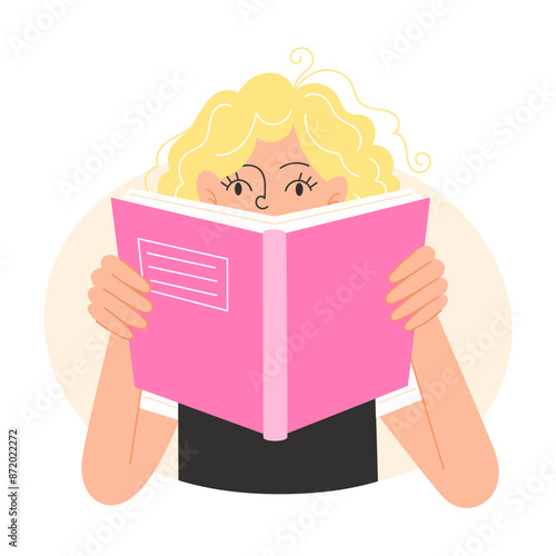 The schoolgirl is reading the textbook with interest
