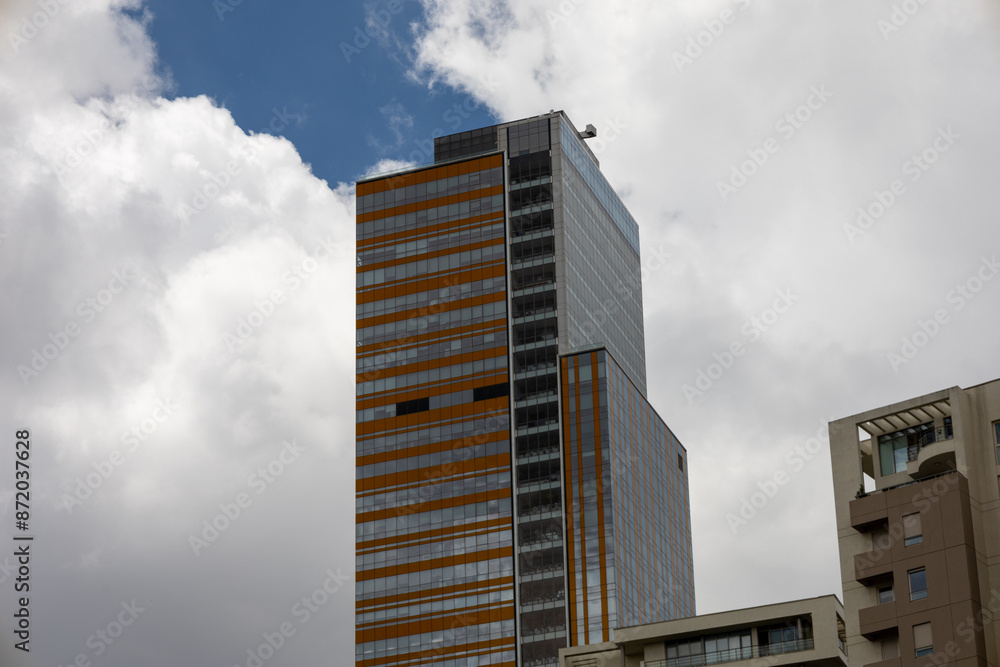Modern Skyscraper Reaching for the Cloudy Sky Modern Skyscraper Reaching for the Cloudy Sky