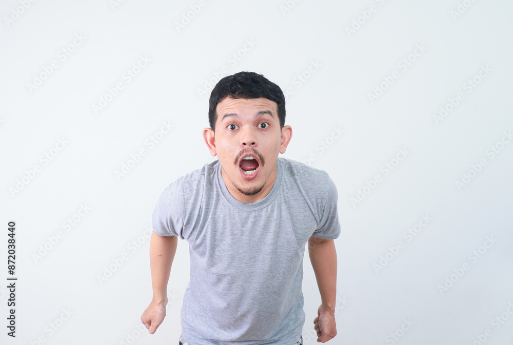 Wow and shocked face of funny Asian man isolated on white background. Wow and shocked face of funny Asian man isolated on white background.