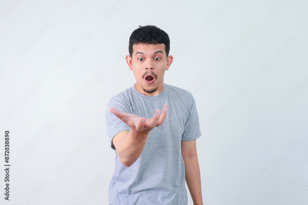 Wow and shocked face of funny Asian man isolated on white background. Wow and shocked face of funny Asian man isolated on white background.