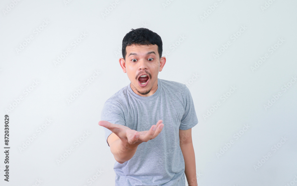 Wow and shocked face of funny Asian man isolated on white background. Wow and shocked face of funny Asian man isolated on white background.