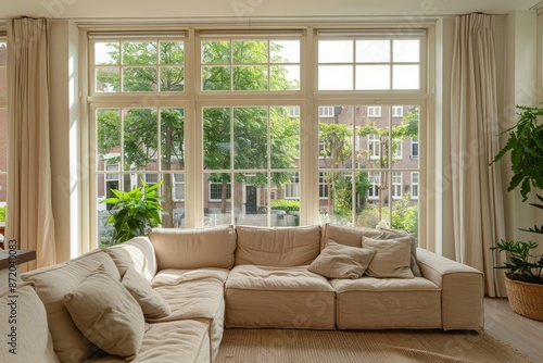 Interior of a living room with a large window overlooking the garden © Iigo