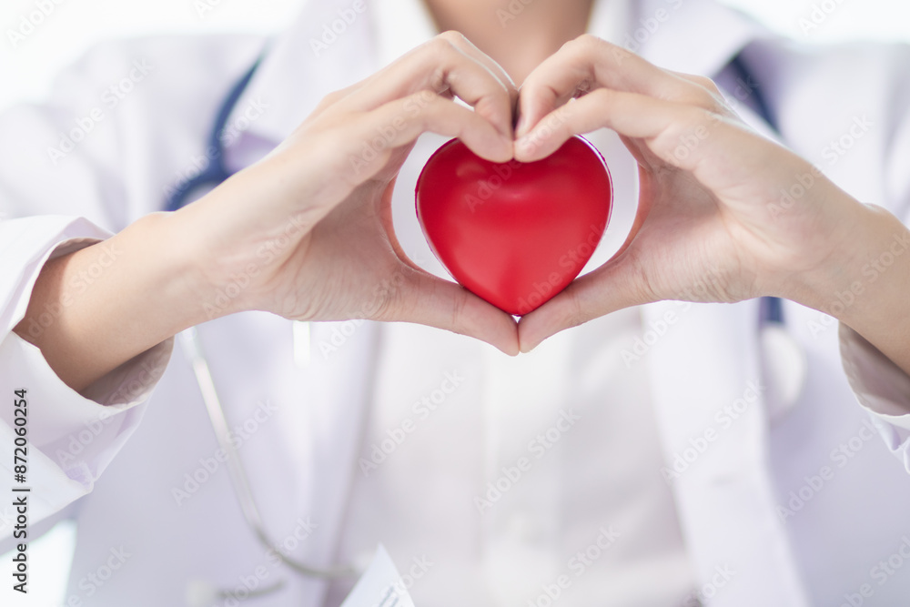 The red heart symbol in the doctor's hand is a symbol of the campaign to care for the health of heart disease patients and encourage people at risk of heart disease to come for regular check-ups. The red heart symbol in the doctor's hand is a symbol of the campaign to care for the health of heart disease patients and encourage people at risk of heart disease to come for regular check-ups.