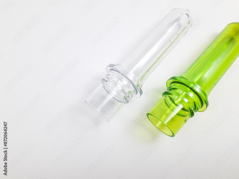 PET preform isolated on a white background, is plastic that is the result of injection before the blow molding process in making PET bottles PET preform isolated on a white background, is plastic that is the result of injection before the blow molding process in making PET bottles