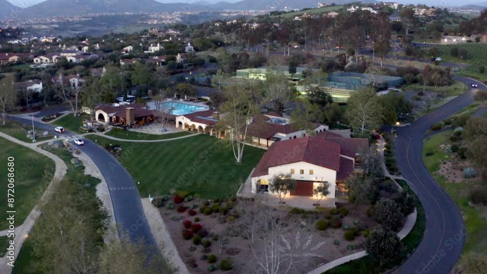 Aerial view of Santaluz golf resort with views of the mountains and surrounding hillside during sunset in San Diego California Aerial view of Santaluz golf resort with views of the mountains and surrounding hillside during sunset in San Diego California