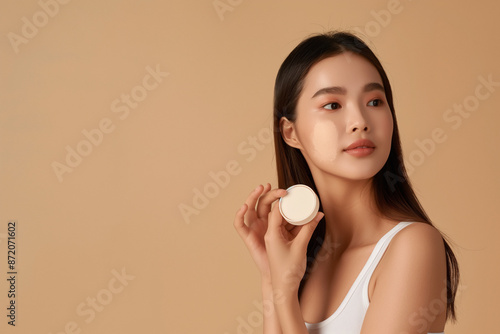 a Young Asian Woman Using Beauty Products