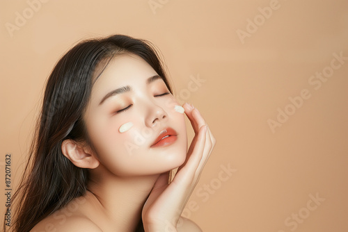 a Young Asian Woman Using Beauty Products