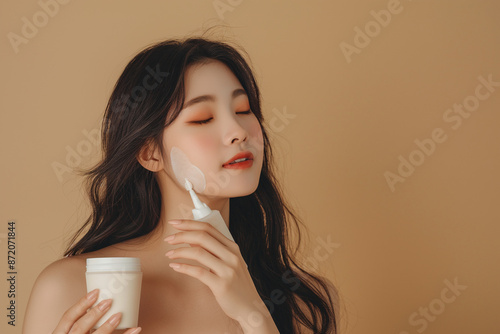 a Young Asian Woman Using Beauty Products