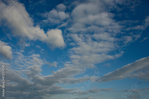 Russia. The South of Western Siberia. Panorama of the evening summer sky with multicolored clouds over the fields of Kuznetsk Alatau. photo