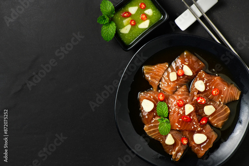 Top view of Pickled Salmon with Soy Sauce, chilli and garlic photo