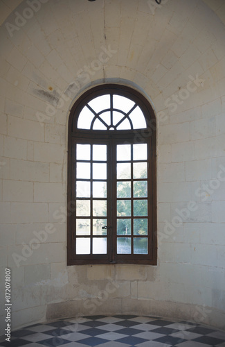 A glimpse of nature through a castle window