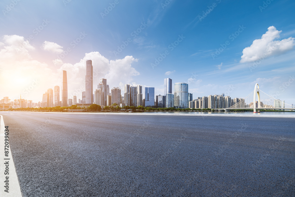 Asphalt highway road and city skyline with modern buildings scenery in Guangzhou. car background. Asphalt highway road and city skyline with modern buildings scenery in Guangzhou. car background.