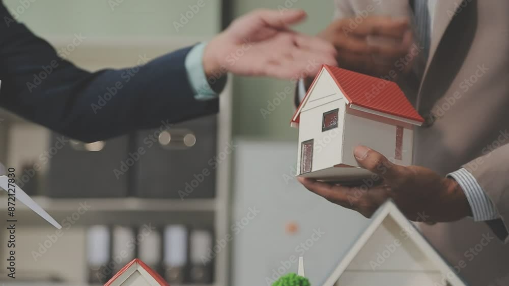 Estate agent are presenting home loan and giving house to client after discussing and signing agreement contract with approved application form, Home Insurance and Real estate investment concept.
Estate agent are presenting home loan and giving house to client after discussing and signing agreement contract with approved application form, Home Insurance and Real estate investment concept.
