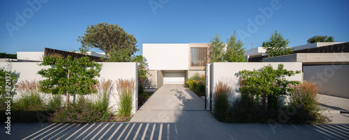 Modern Home with Pool, Designer Features, and Lush Greenery